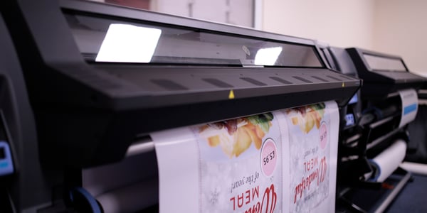 Poster being printed on a large format print machine