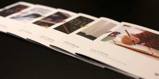 brochures on table printed on luxury printing paper