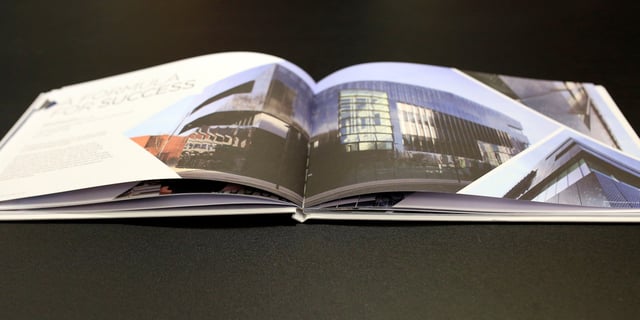 Luxury brochure opened on a table