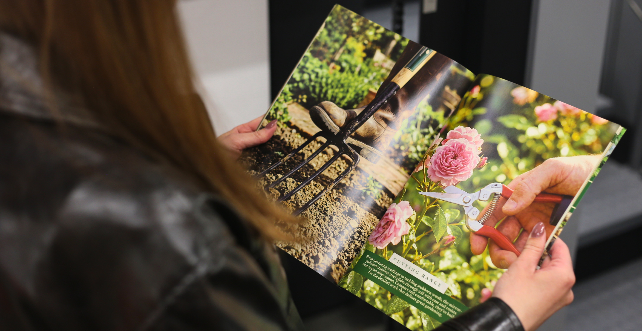 Someone holding a printed catalogue